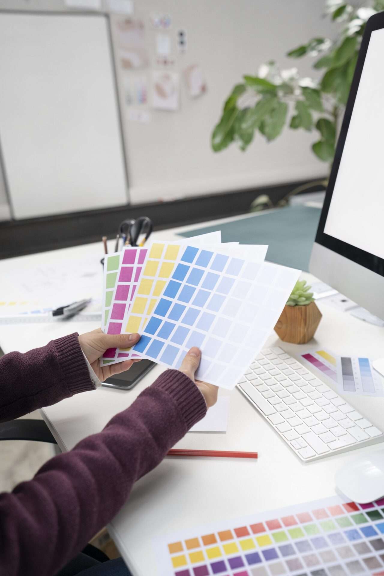 young-female-designer-choosing-right-colors-logo young-female-designer-choosing-right-colors-logo